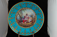 P127 - SEVRES “JEWELED” TURQUOISE-GROUND CUP AND SAUCER