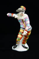 P004 - MEISSEN FIGURE OF A “SCOWLING HARLEQUIN”