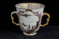P075 - TWO MEISSEN TWO-HANDLED BEAKERS AND SAUCERS 