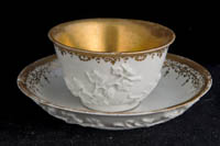 P093 - MEISSEN GILT-WHITE TEABOWL AND A SAUCER