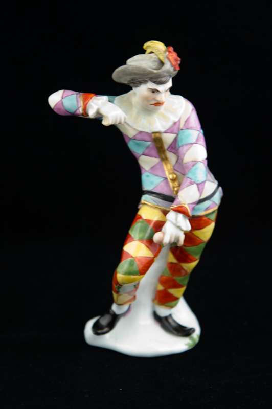 P004 - MEISSEN FIGURE OF A “SCOWLING HARLEQUIN”